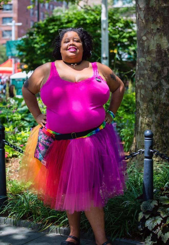 a woman in a purple dress
