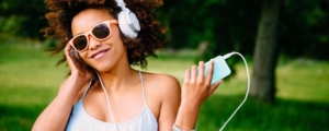 woman with headphones summer playlist