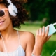 woman with headphones summer playlist