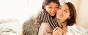 asian woman with young daughter banner