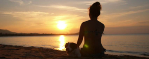 Woman Meditating on Beach