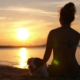 Woman Meditating on Beach