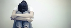 Woman with Head in Knees