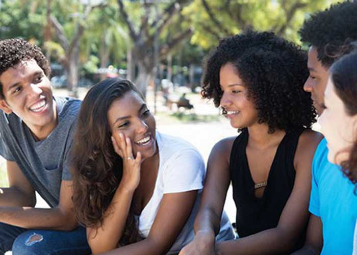 People of color smiling and talking