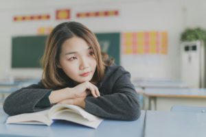 Girl leaning on book